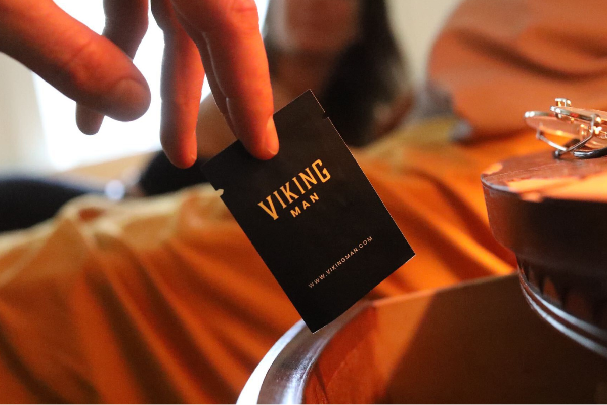 Viking Man ED Pill Pack Held by Hand
